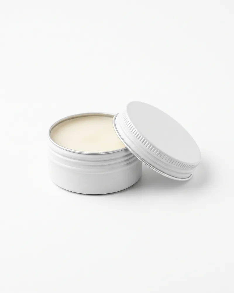 Ground Balm — white metal tin with ivory balm
